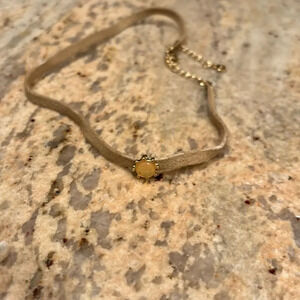 Woman's choker with pretty stone in it